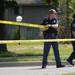 An Ann Arbor police officer marks off an area with caution tape after a pedestrian was struck by a car while attempting to cross Plymouth Rd. between Traverwood Dr. and Nixon Rd. on Wednesday, August 7, 2013. Melanie Maxwell | AnnArbor.com 